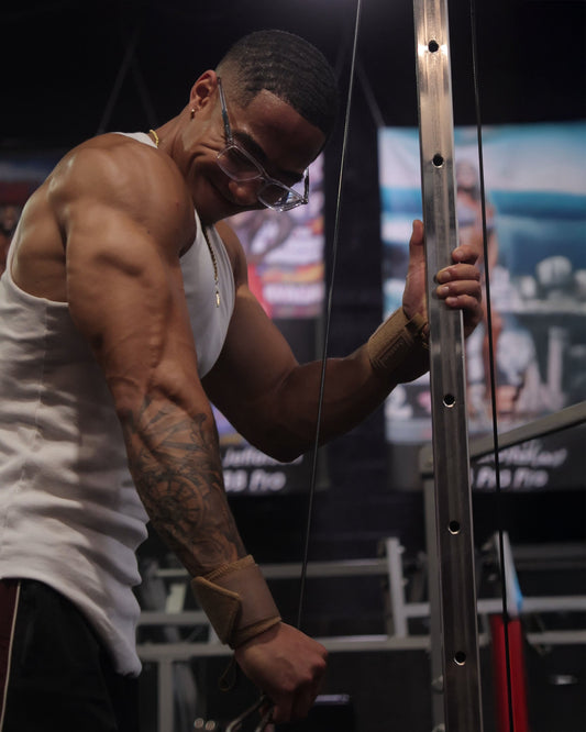 man doing push workout wearing uppper wrist wraps