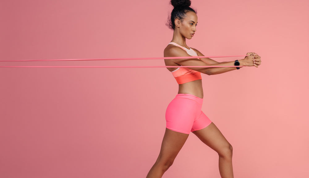 woman doing ab exercise with long resistance band